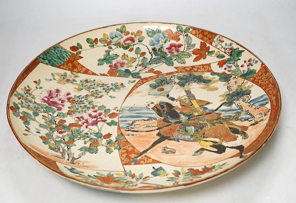 A Japanese Kutani earthenware charger, Meiji period, 36.5cm diameter. Condition - fair